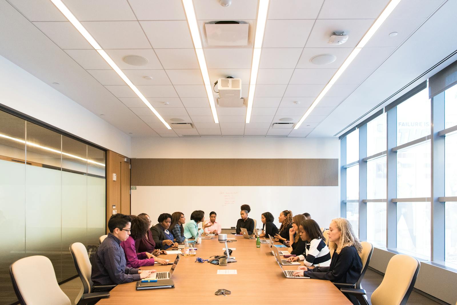 Diverse team meeting in corporate boardroom