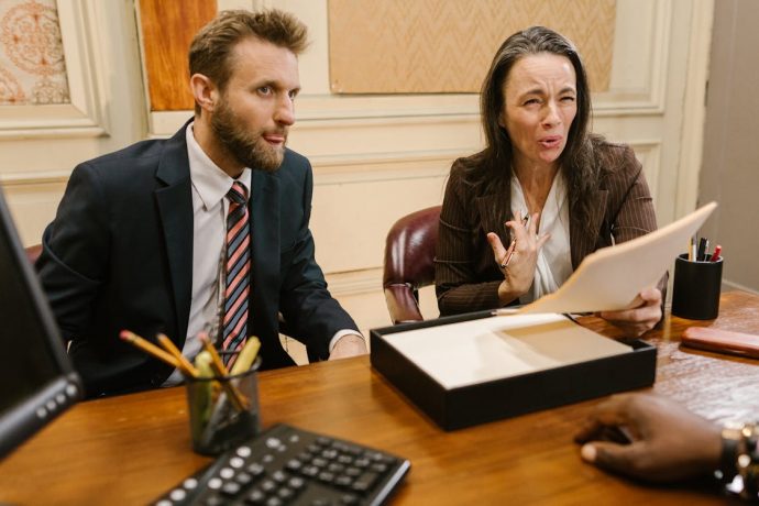 fractional-gc-business-meeting Attorney advising business client on legal counsel options